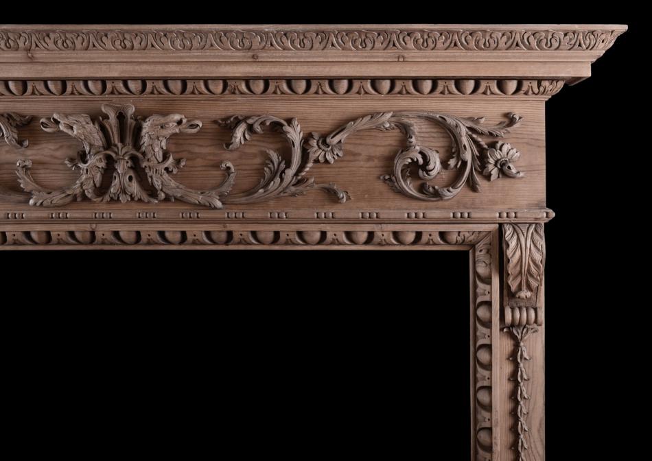 A fine quality carved pine fireplace