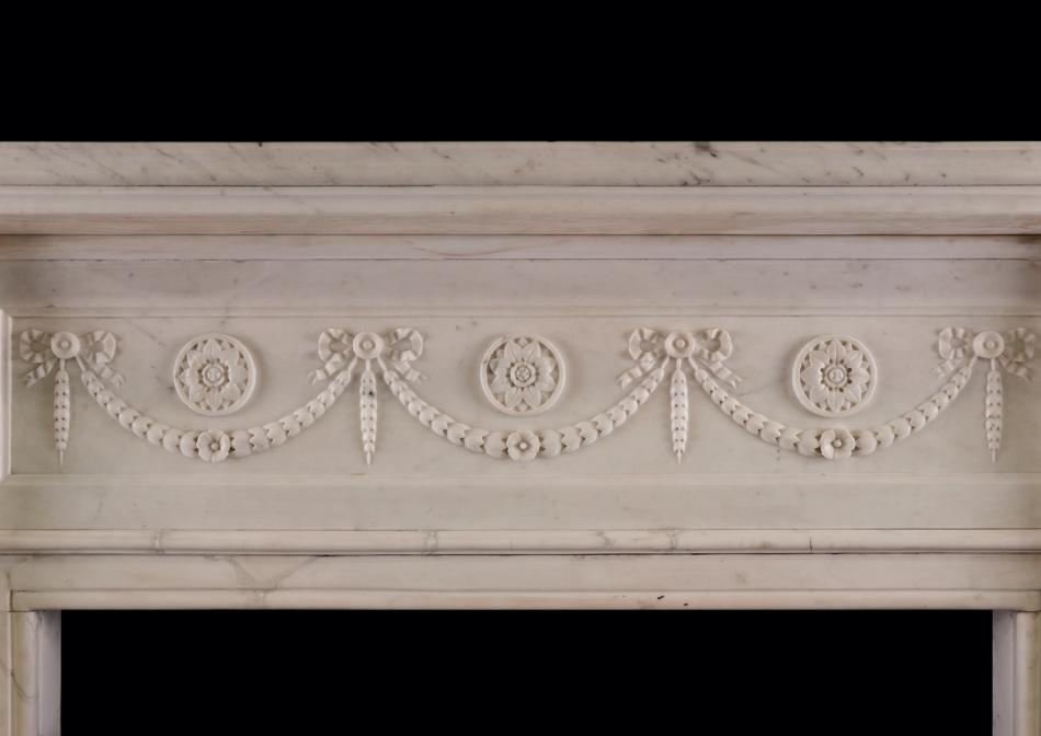 An early Victorian fireplace in white Statuary marble