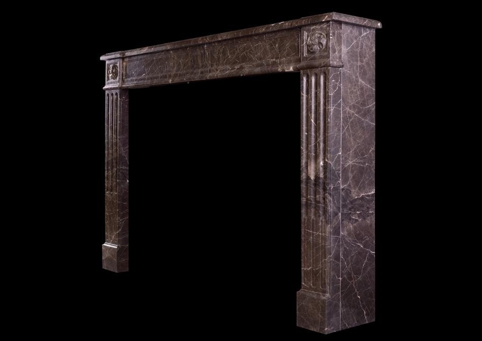 A French marble fireplace in the Louis XVI style