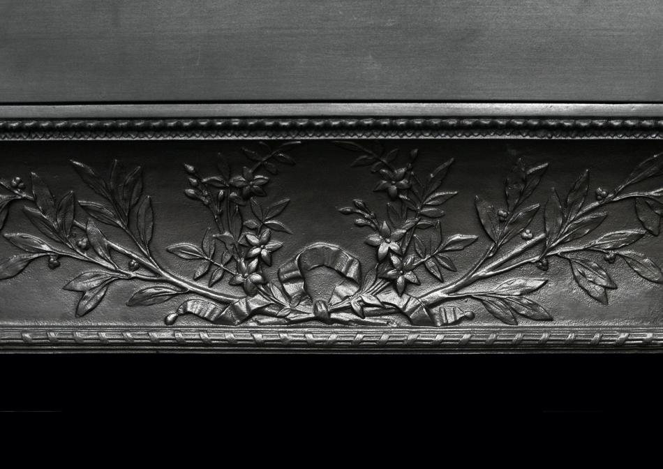 A decorative cast iron contracoeure fireplace interior