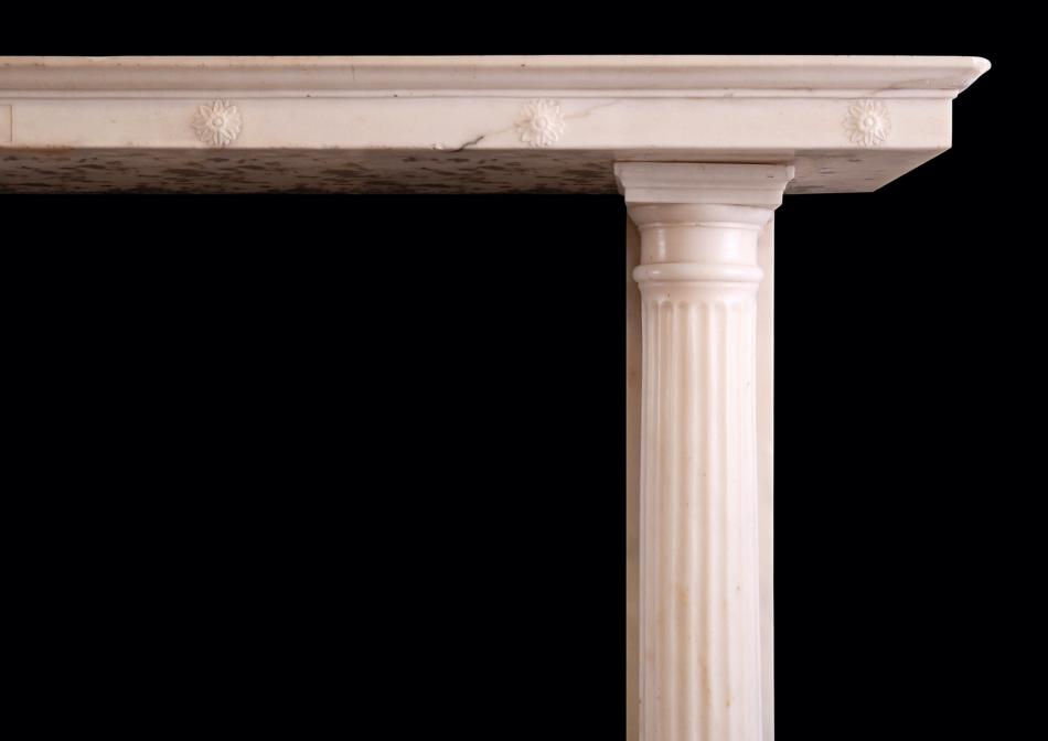A classical Regency fireplace in white Statuary marble