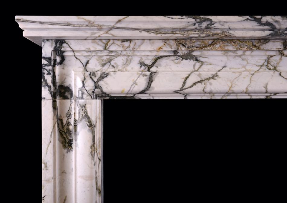 An English moulded bolection fireplace in Calacatta Verde marble
