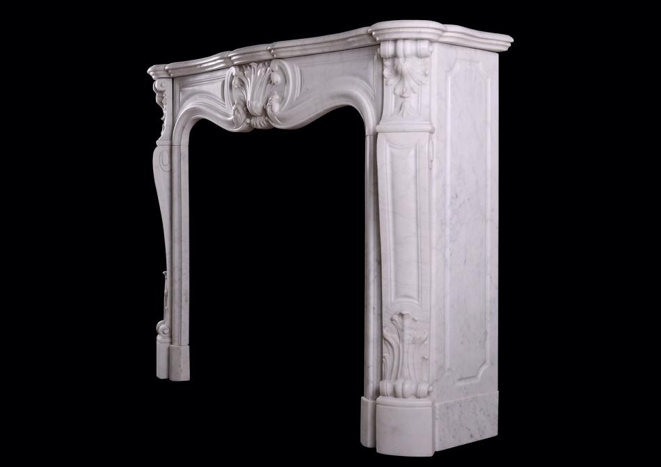 A French Carrara marble fireplace in the Louis XV style