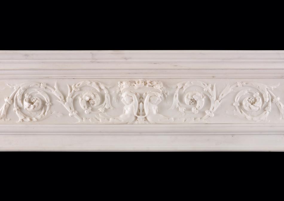 A Statuary marble fireplace with Italian Sienna marble inlay