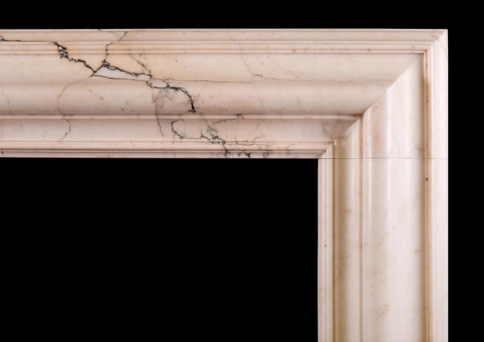 A bolection fireplace in Pavonazzo marble