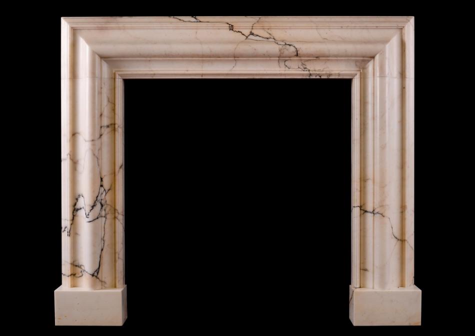A bolection fireplace in Pavonazzo marble