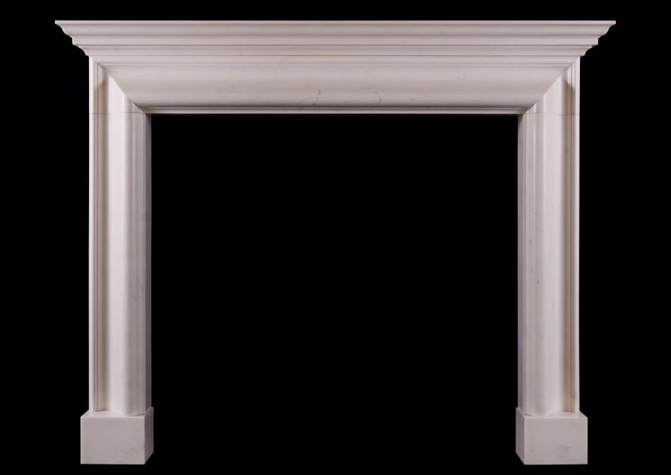 An English bolection fireplace with moulded shelf above