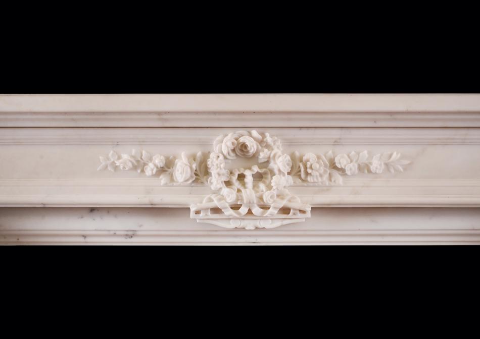 A Statuary white marble fireplace in the Louis XVI style