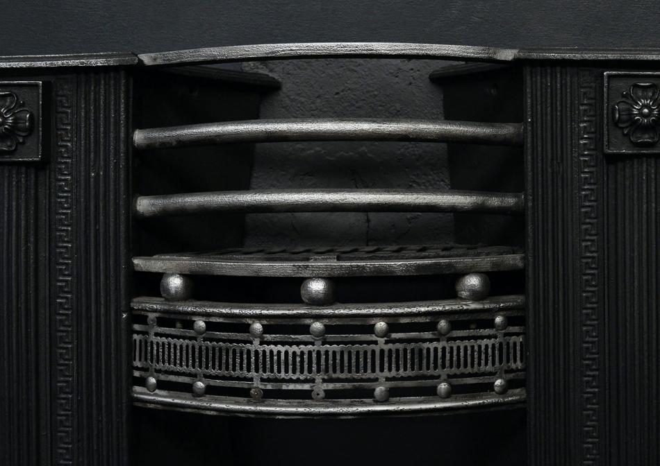 A 19th century English Regency cast iron hob grate