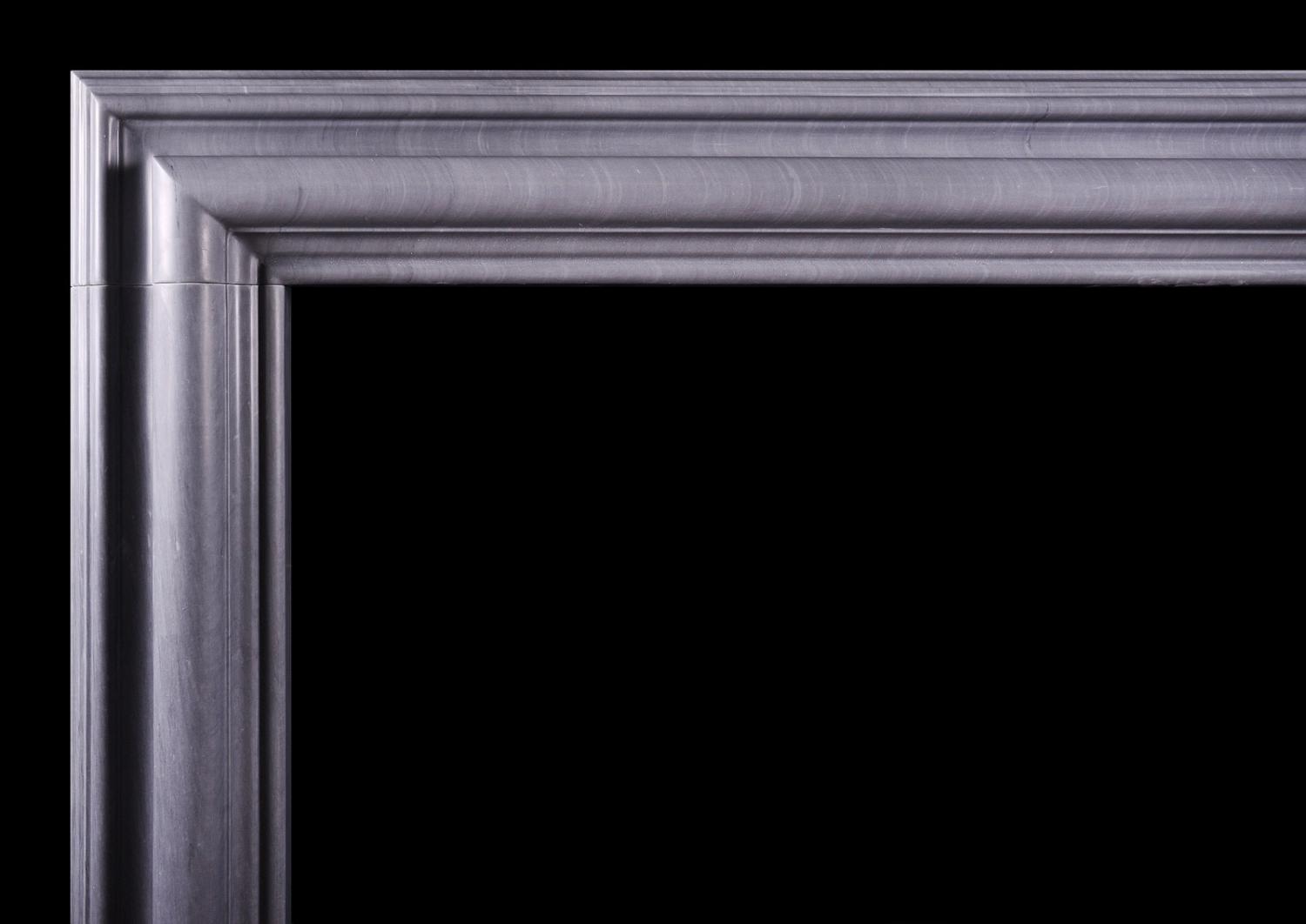 A bolection fireplace in Italian Bardiglio grey marble