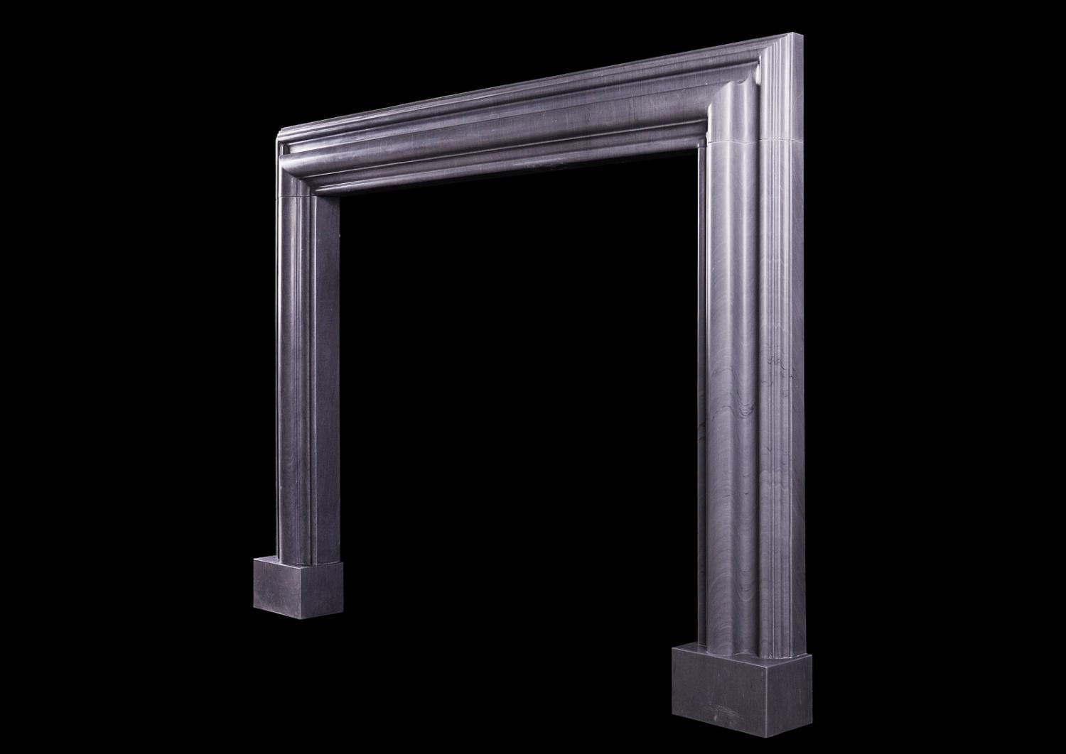 A bolection fireplace in Italian Bardiglio grey marble