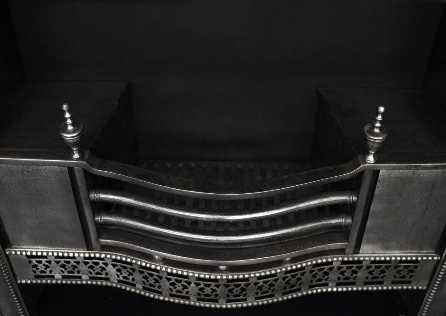 A period Georgian register grate in the manner of Robert Adam