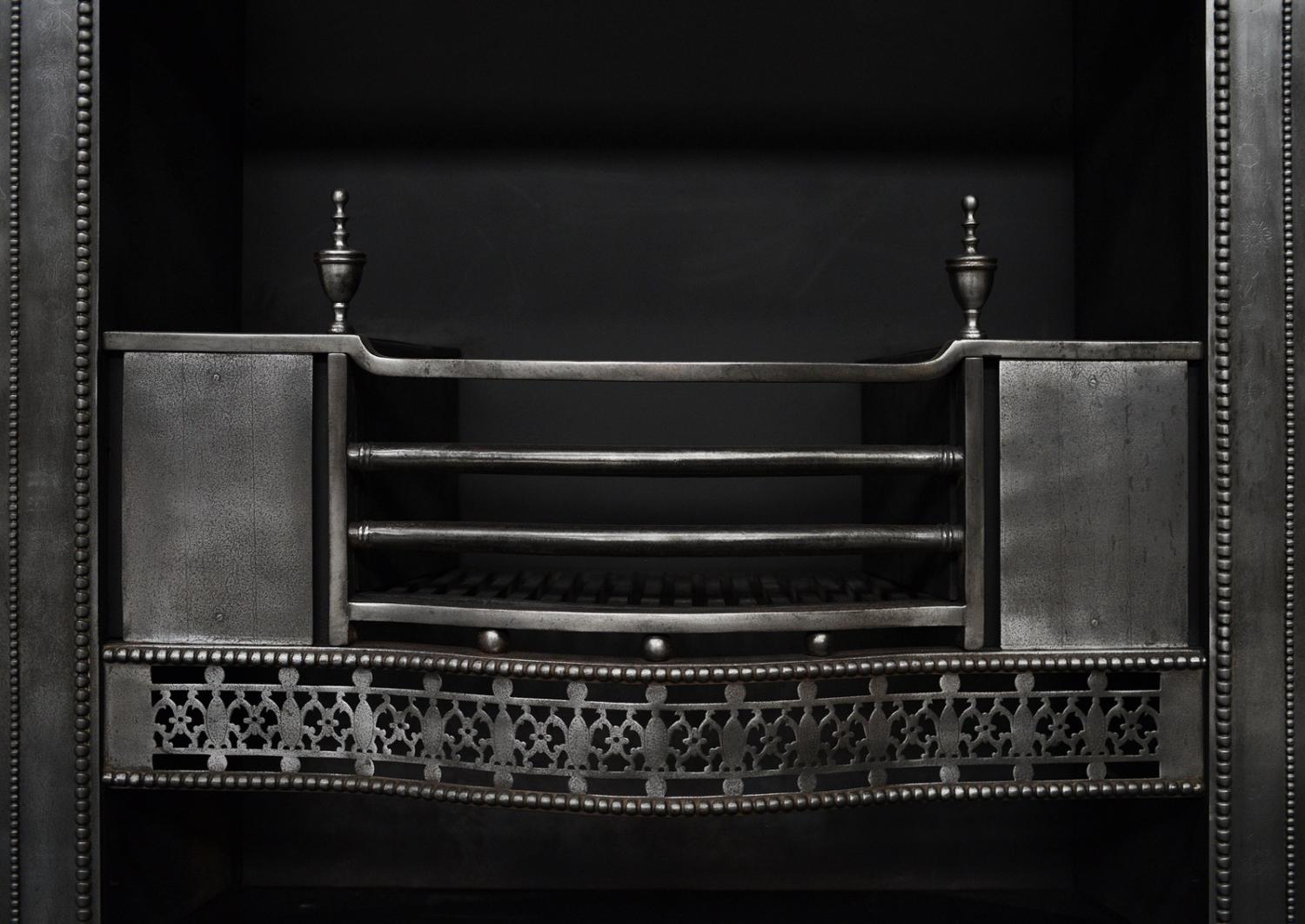 A period Georgian register grate in the manner of Robert Adam