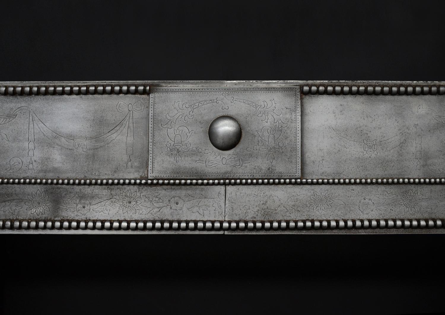 A period Georgian register grate in the manner of Robert Adam