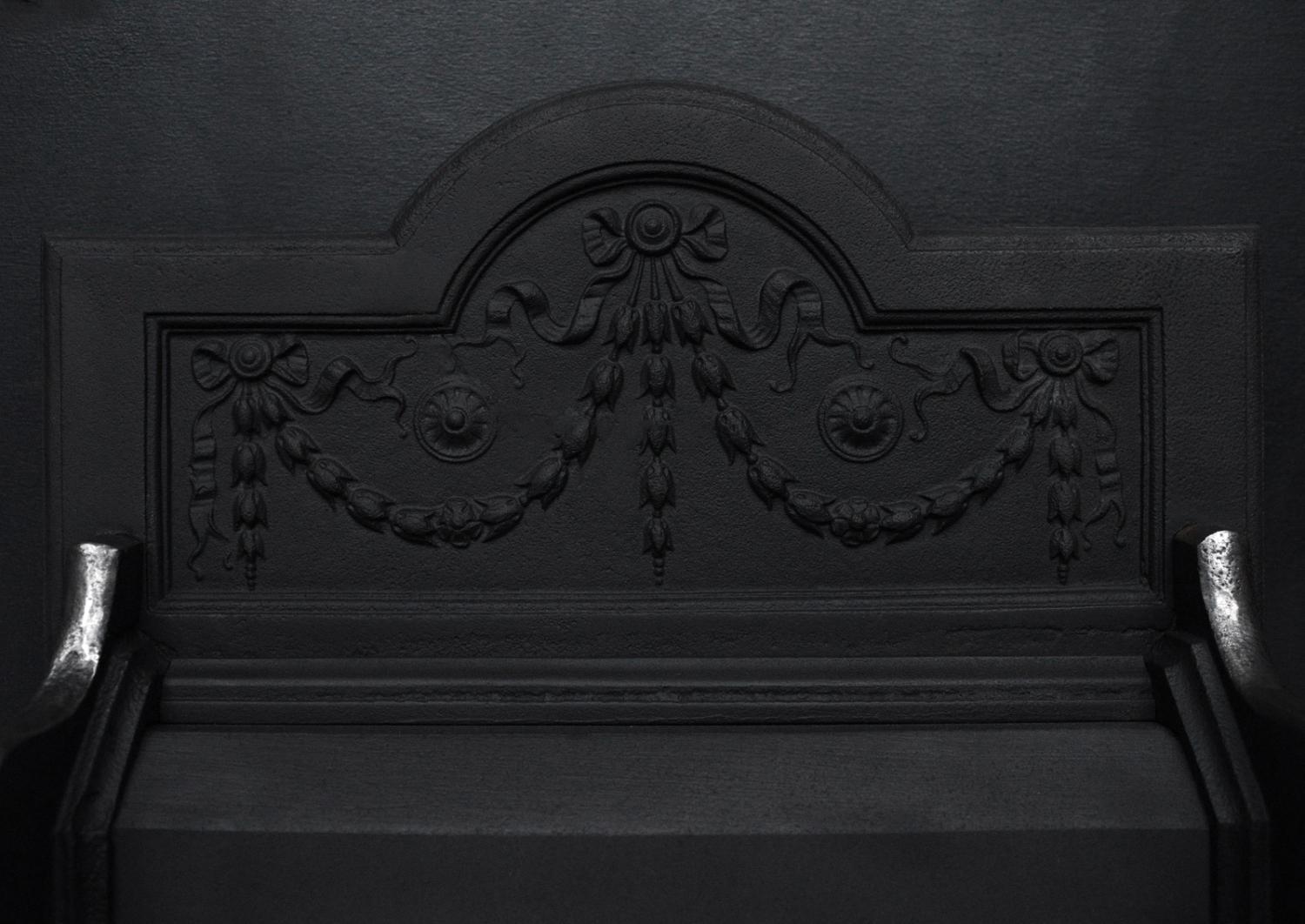 A brass and steel firegrate in the Georgian manner