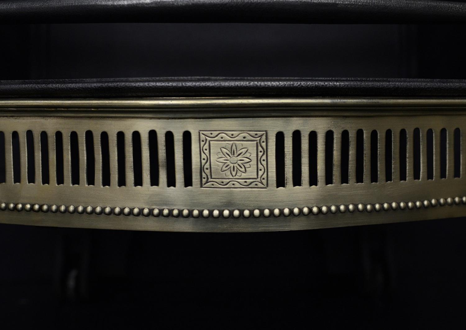 A brass and steel firegrate in the Georgian manner