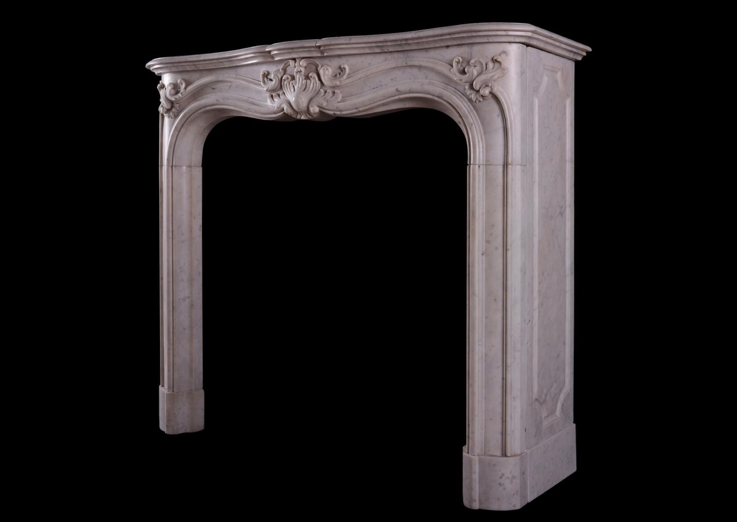 A French marble fireplace in the Louis XV manner.