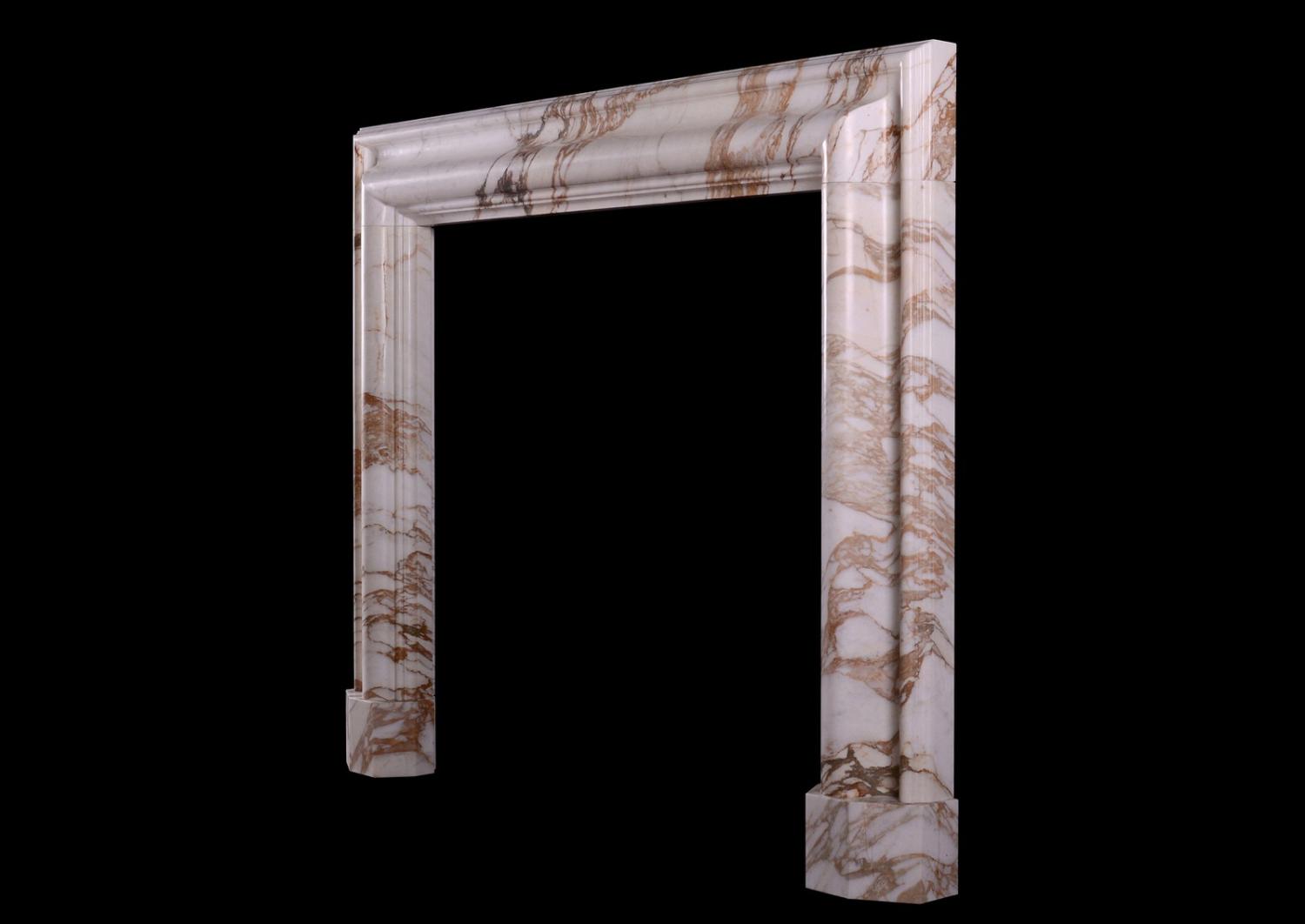 An English bolection fireplace in Calacatta Oro marble