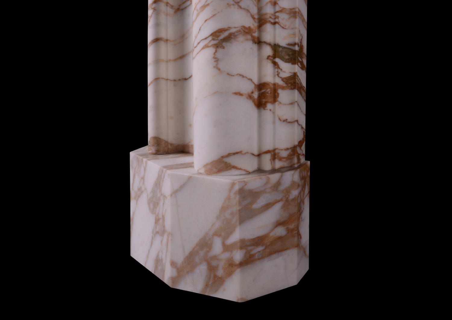 An English bolection fireplace in Calacatta Oro marble