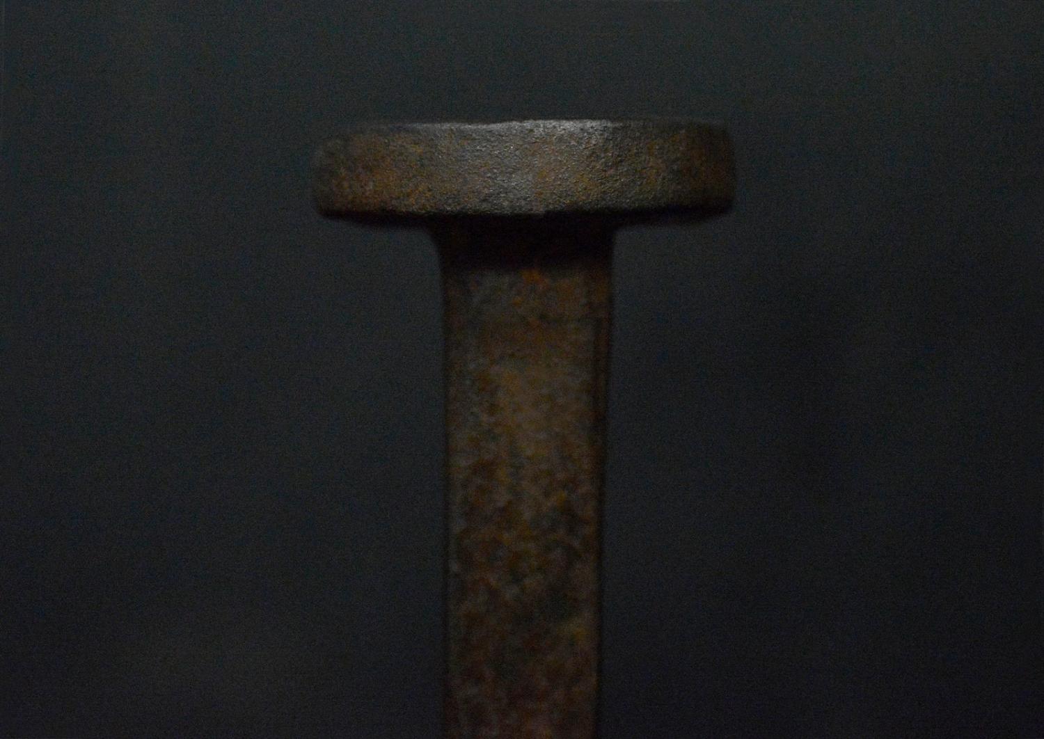 A pair of wrought iron firedogs