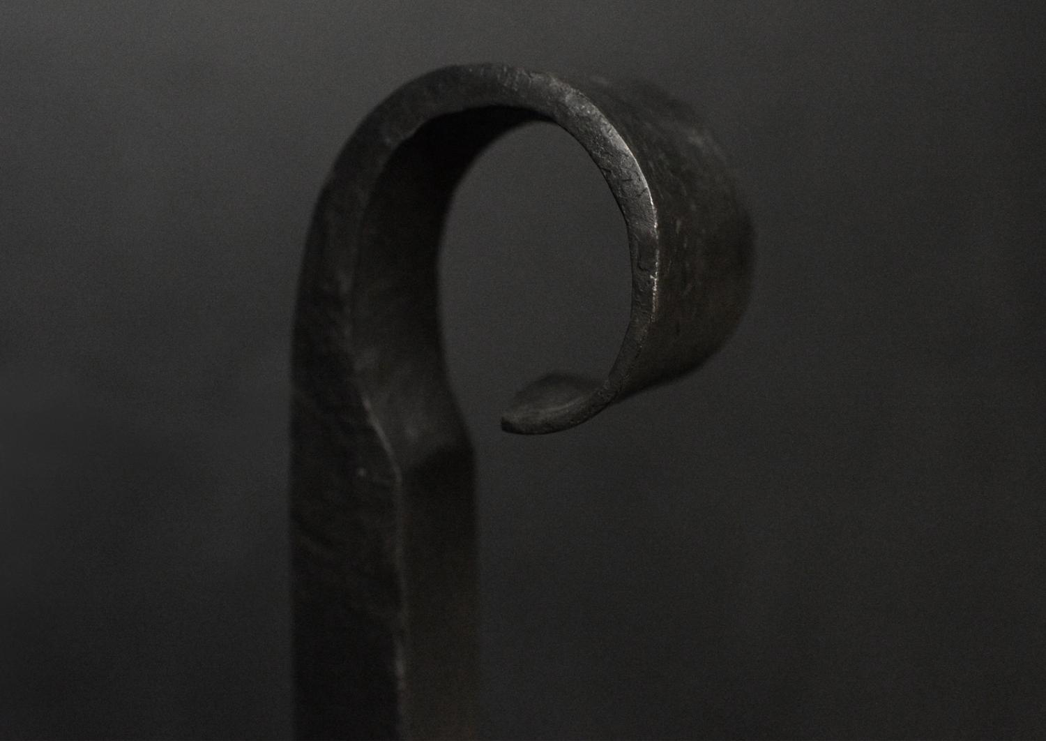 A pair of wrought iron firedogs