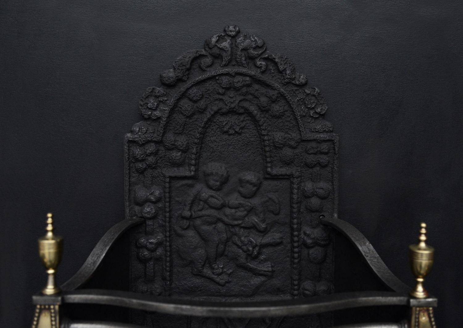 An English brass and steel firegrate in the Georgian style