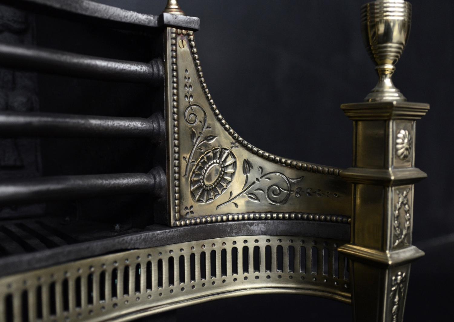 An English brass and steel firegrate in the Georgian style