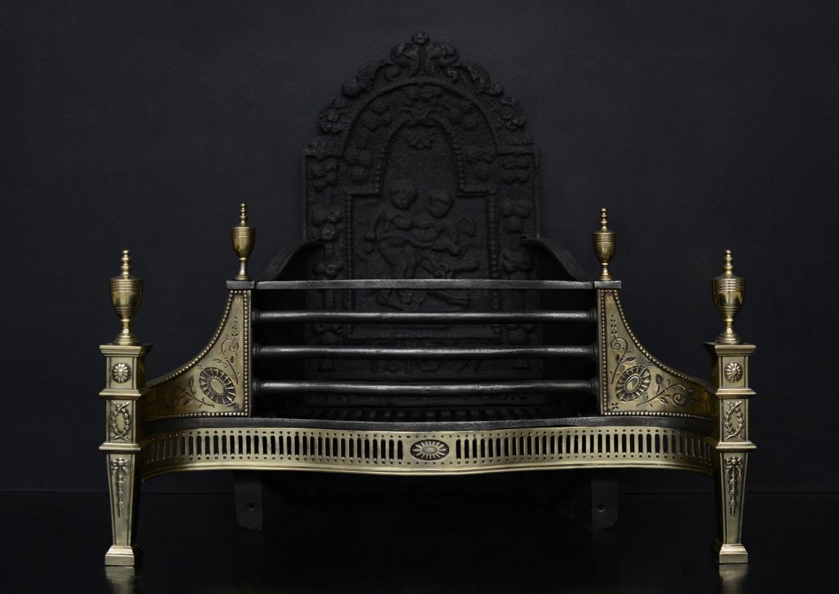 An English brass and steel firegrate in the Georgian style