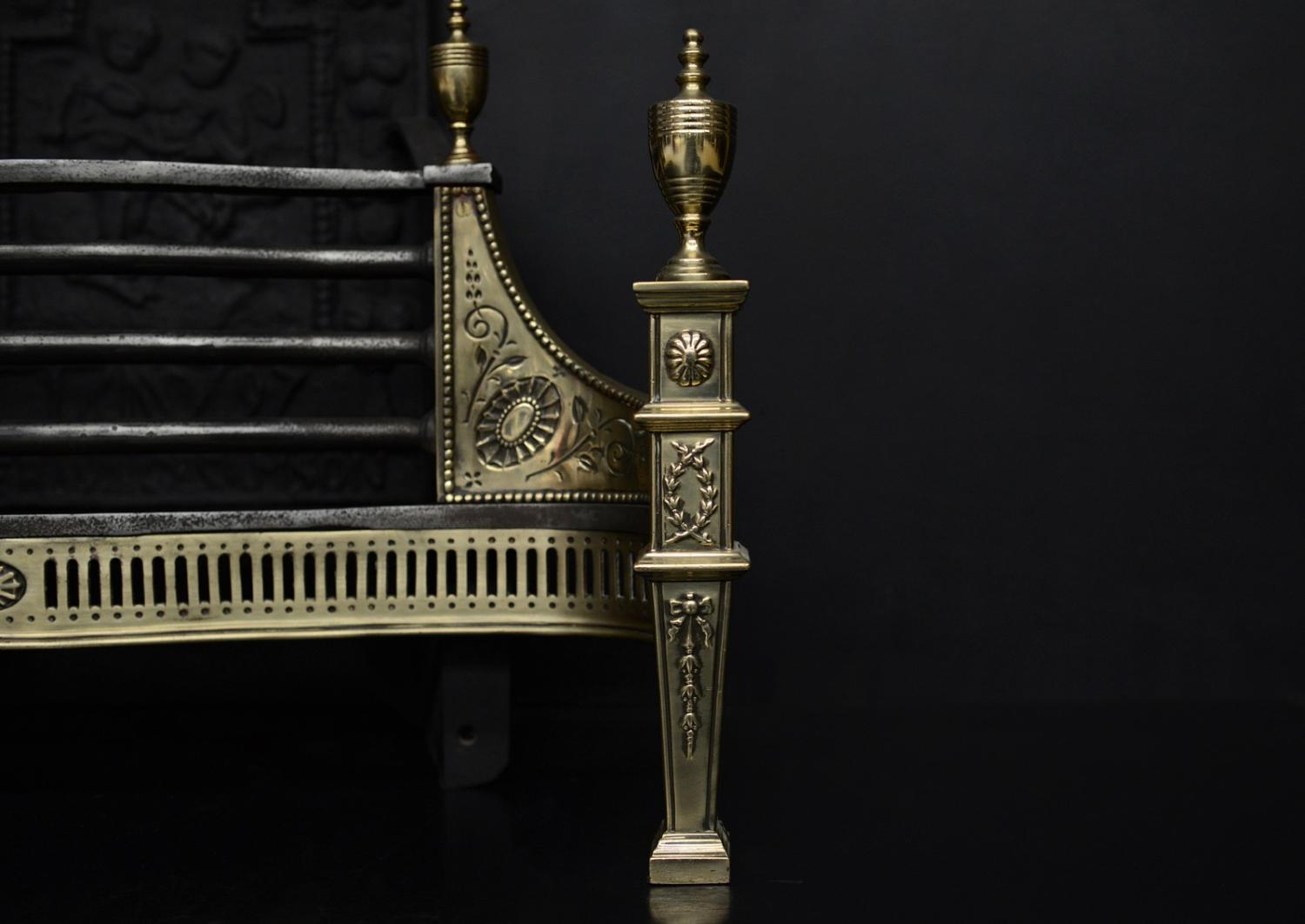 An English brass and steel firegrate in the Georgian style