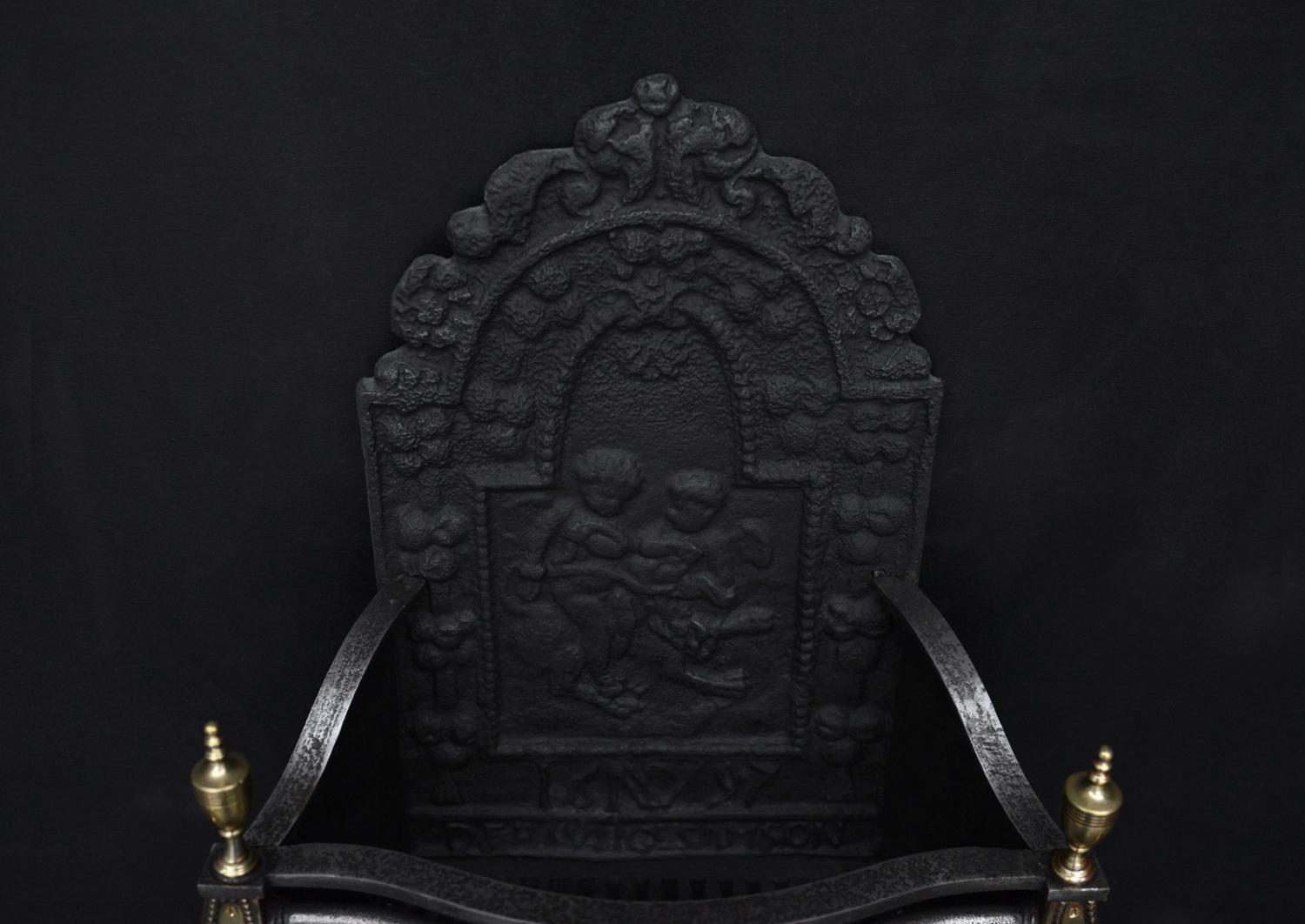 An English brass and steel firegrate in the Georgian style