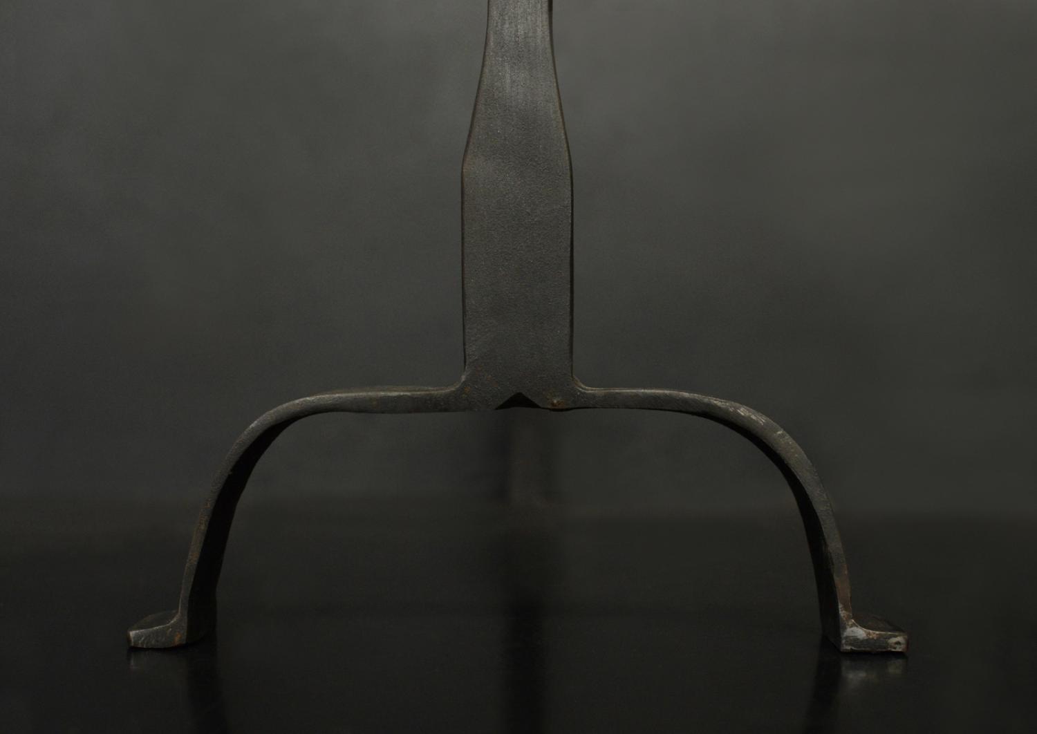 A pair of firedogs in black lead