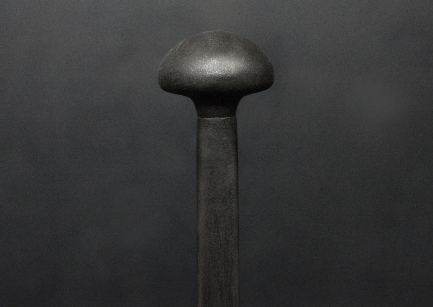 A pair of firedogs in black lead