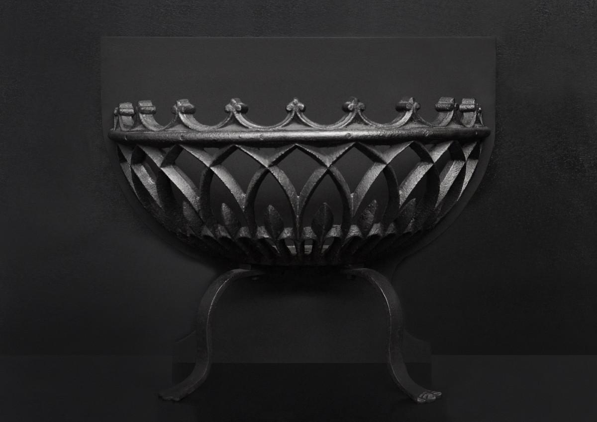 A bowed wrought iron firegrate