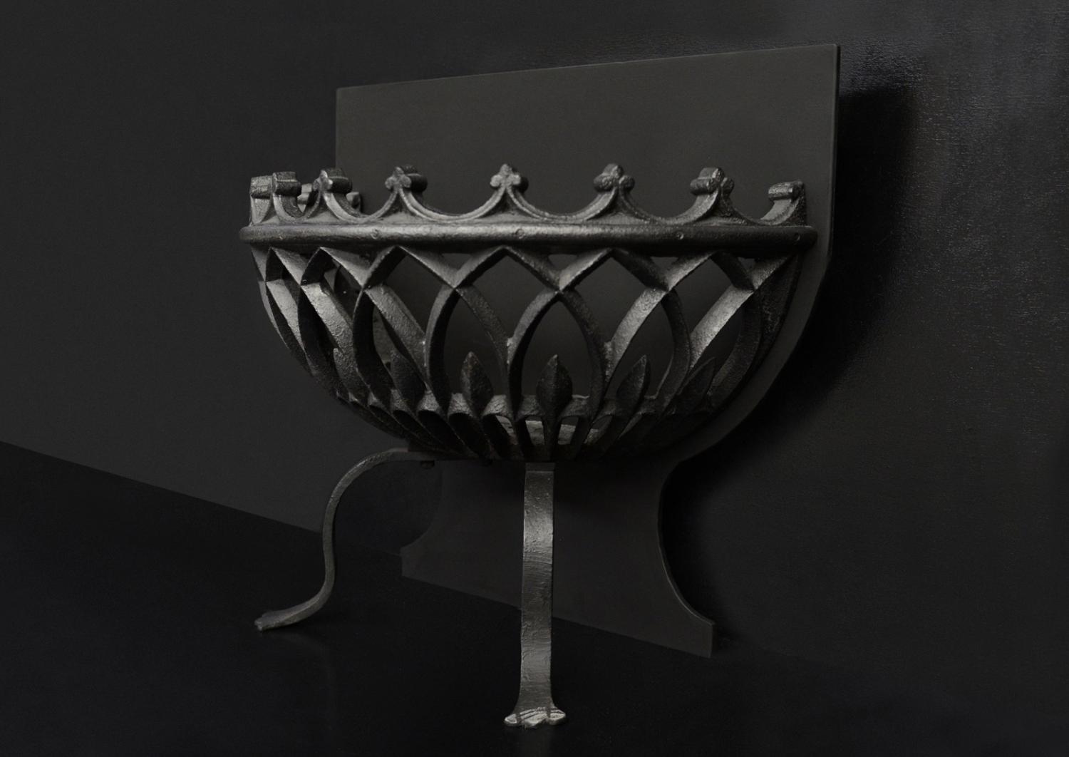 A bowed wrought iron firegrate