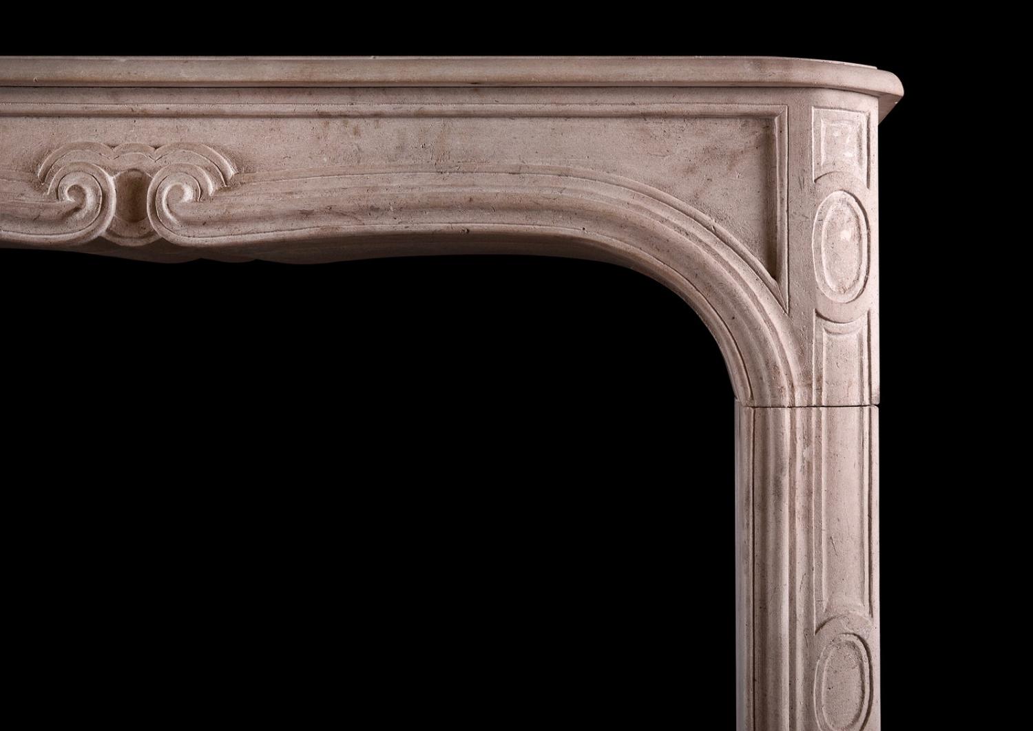 A French limestone transitional Louis XIV/XV fireplace