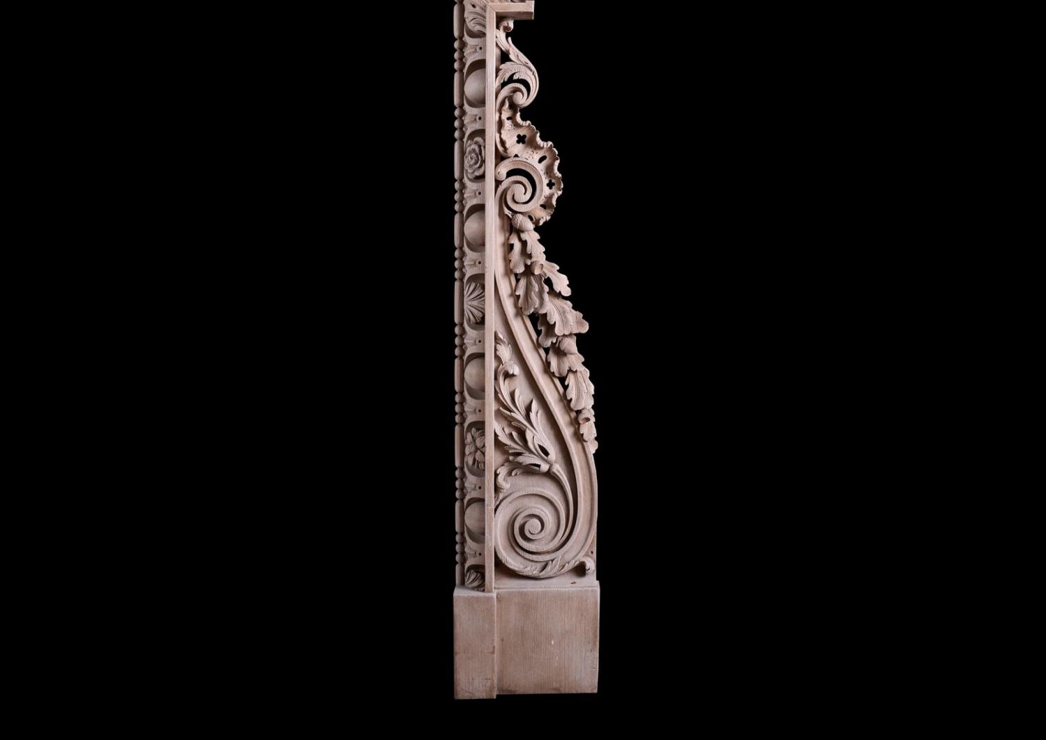 A carved pine fireplace in the George III style