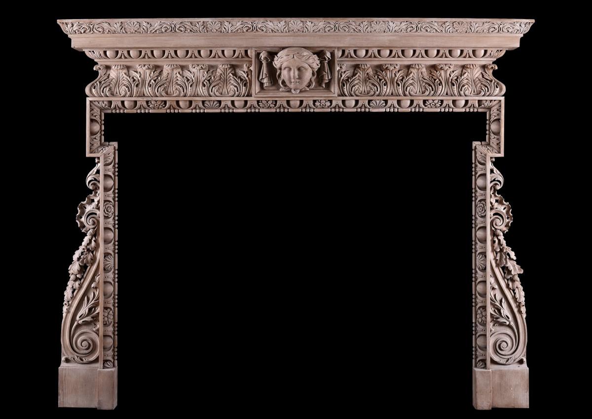 A carved pine fireplace in the George III style