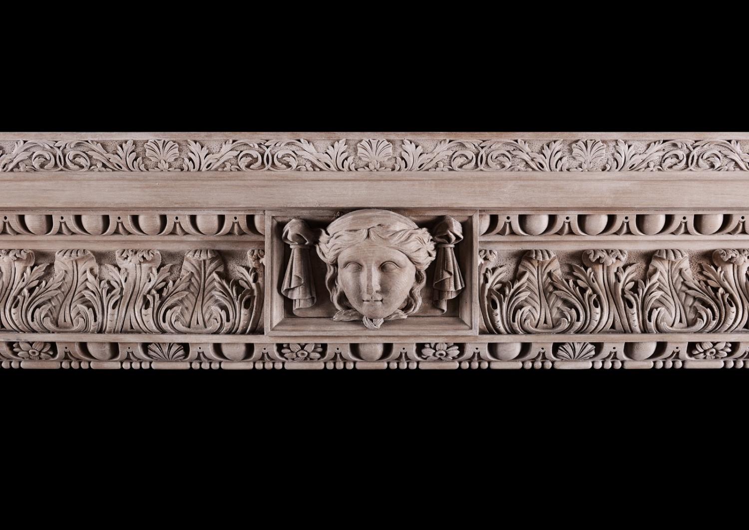 A carved pine fireplace in the George III style