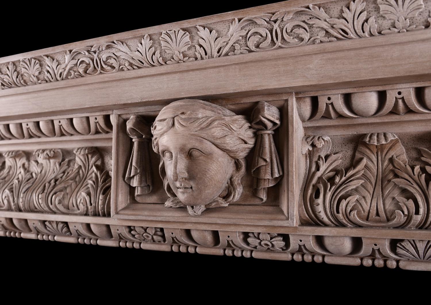 A carved pine fireplace in the George III style