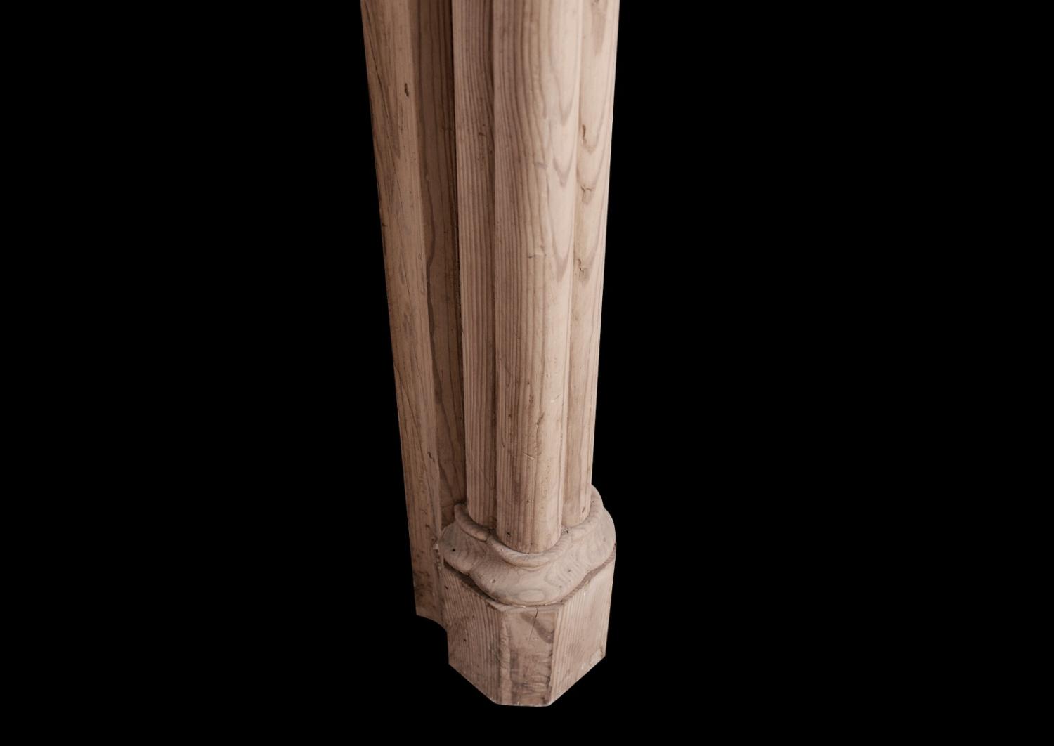 An English pine fireplace in the Gothic manner