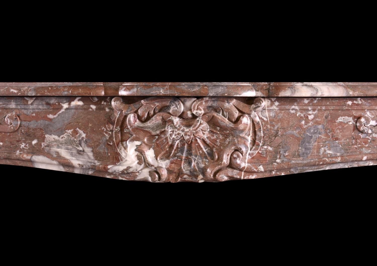 A period French marble fireplace in Languedoc marble