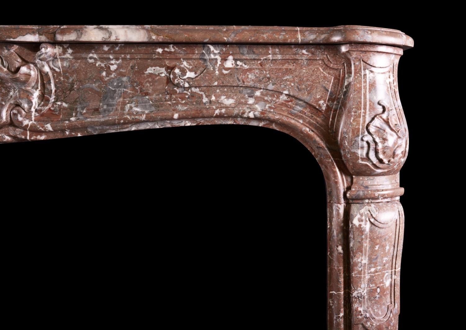 A period French marble fireplace in Languedoc marble