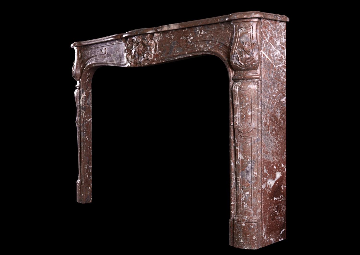 A period French marble fireplace in Languedoc marble