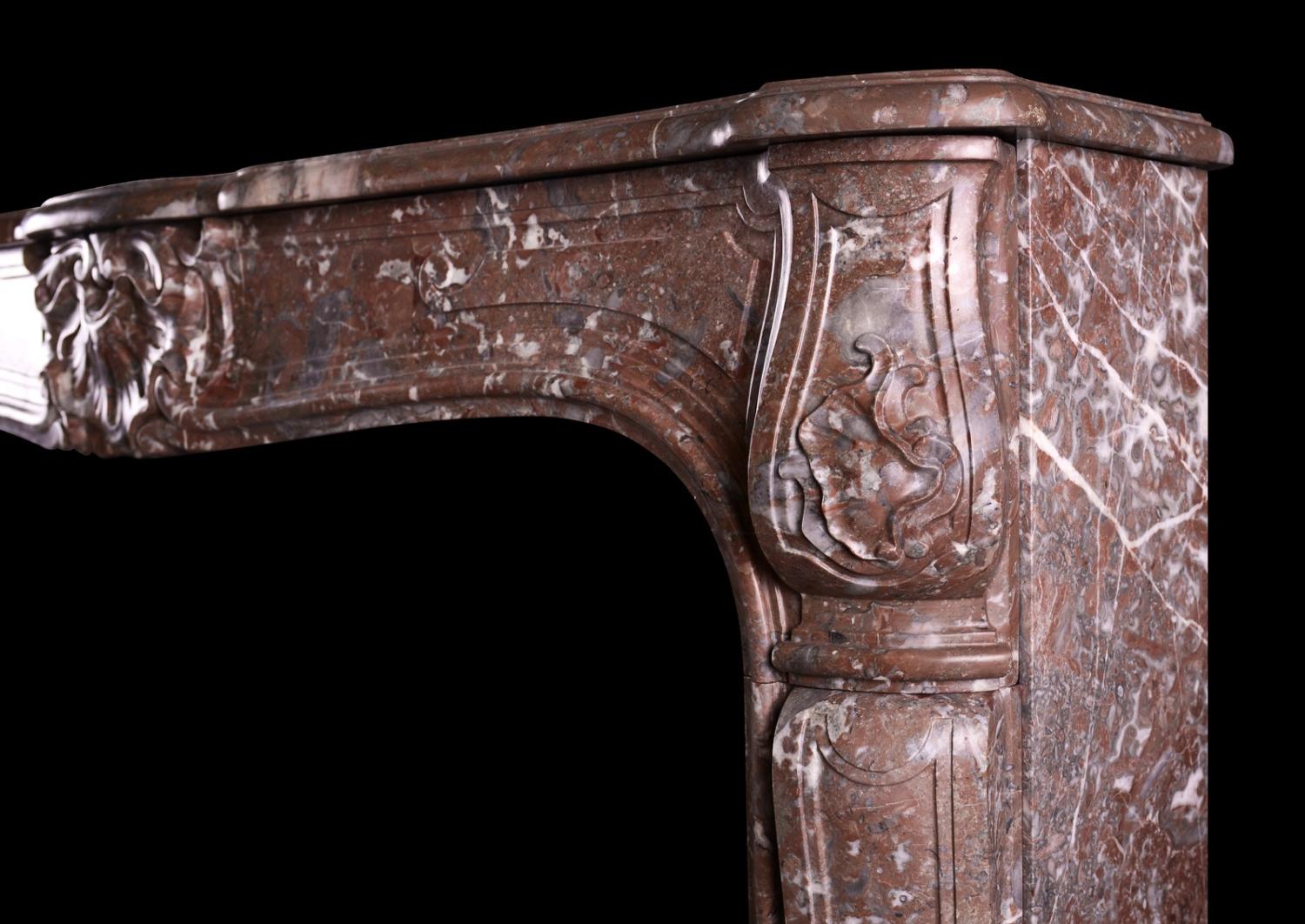 A period French marble fireplace in Languedoc marble