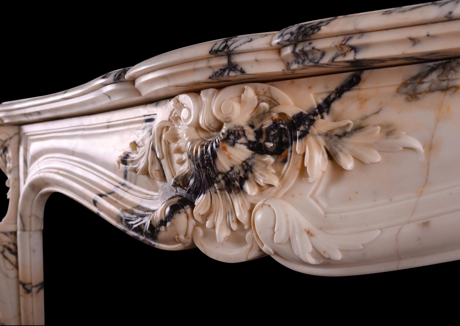 A fine quality Louis XV Paonazzo marble fireplace