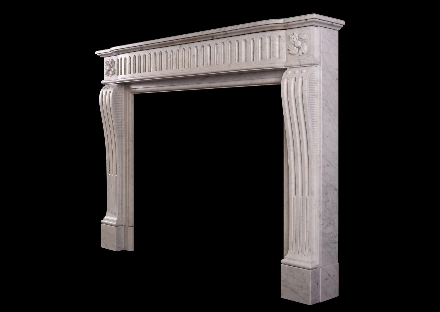 A Louis XVI style fireplace in a light Carrara marble