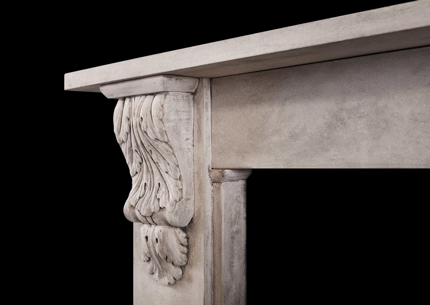 A reclaimed stone fireplace in the mid Victorian manner
