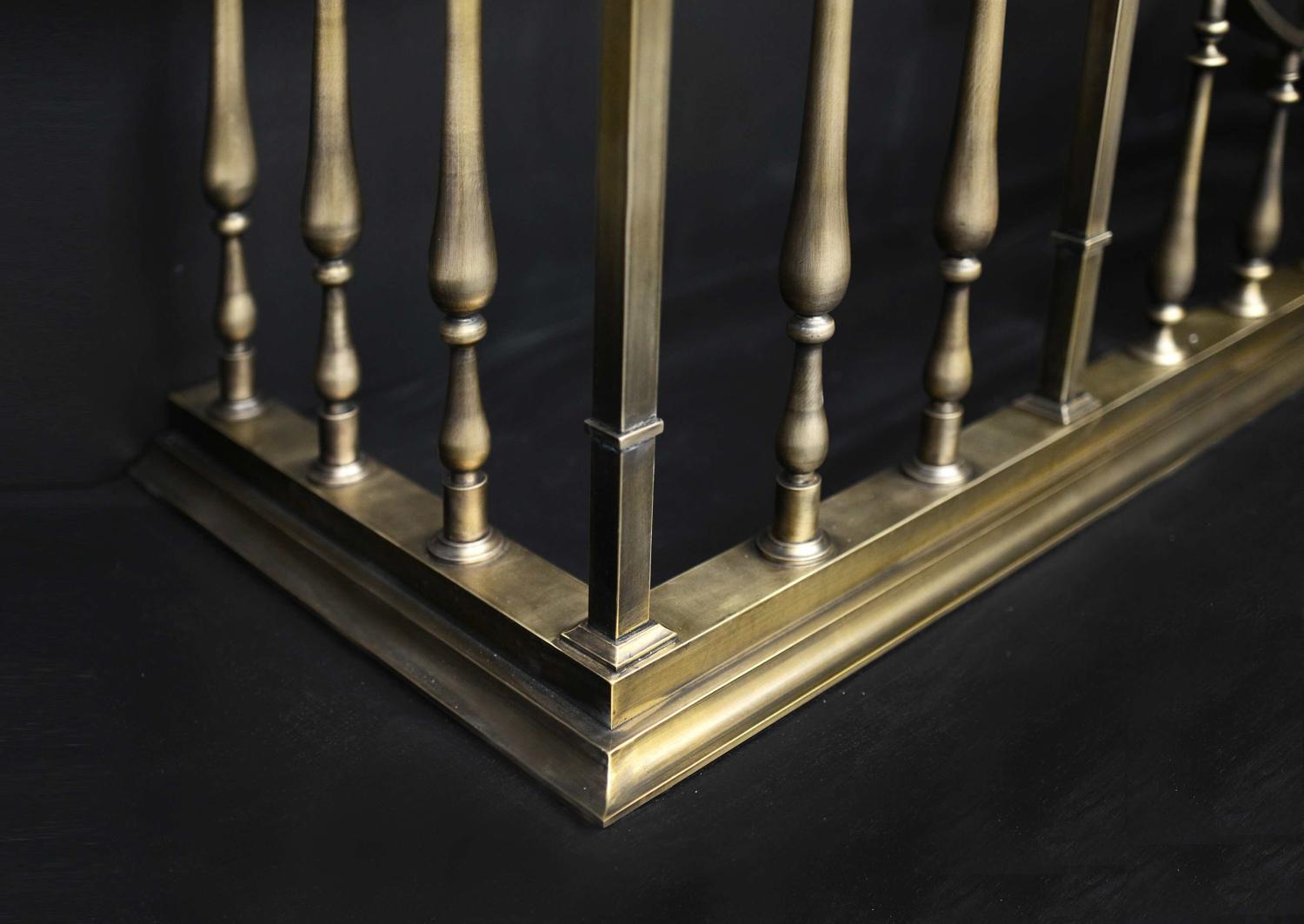 A fine quality club fender in antiqued brass finish