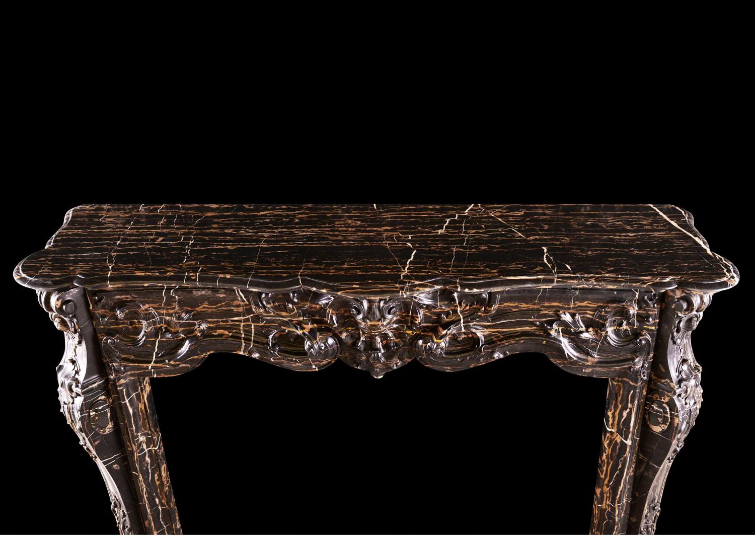 A striking Louis XV style marble fireplace