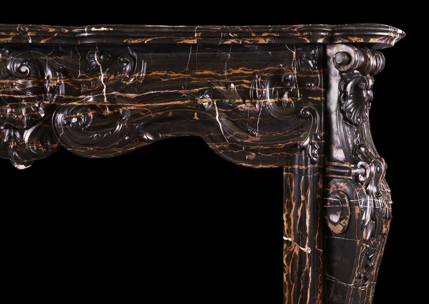 A striking Louis XV style marble fireplace